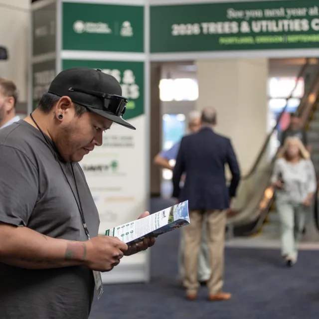 Conference attendee reviews program