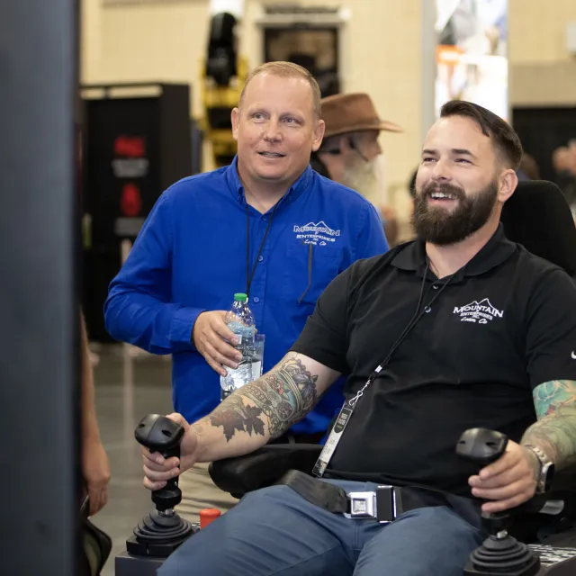 Conference attendee demos new technology at trade show